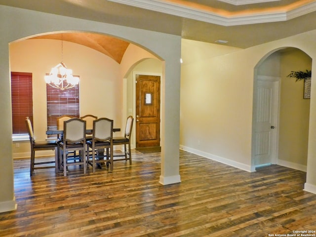 dining area with a chandelier, dark wood-type flooring, and crown molding