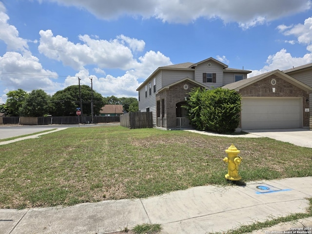 exterior space with a garage and a yard