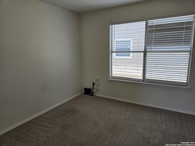 empty room featuring carpet flooring