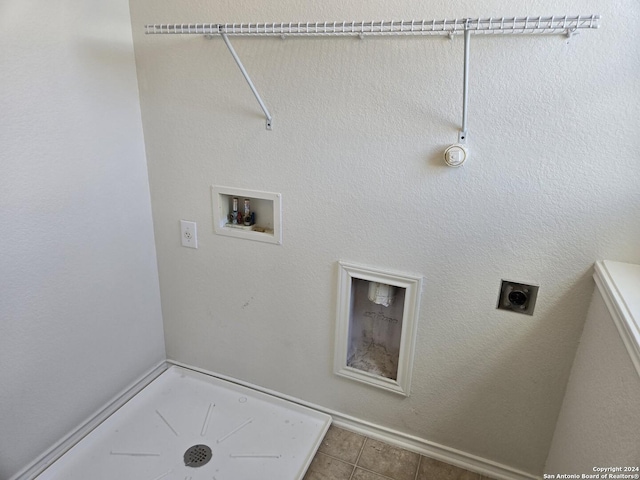 laundry area with washer hookup, hookup for a gas dryer, hookup for an electric dryer, and tile patterned flooring