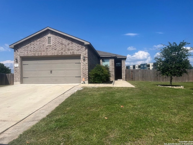 ranch-style home with a garage and a front yard