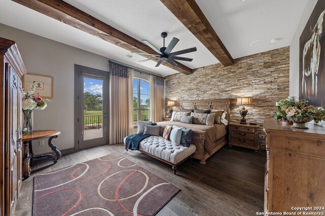 bedroom featuring visible vents, beam ceiling, access to exterior, and wood finished floors