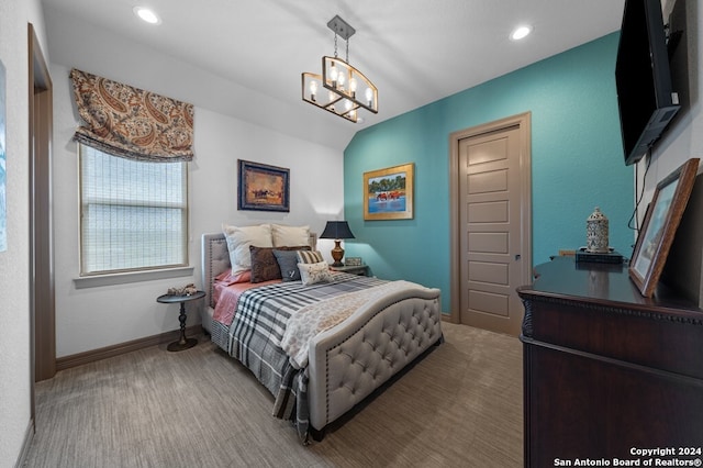 carpeted bedroom with lofted ceiling and an inviting chandelier