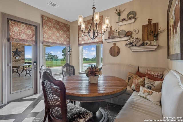 dining area featuring a notable chandelier