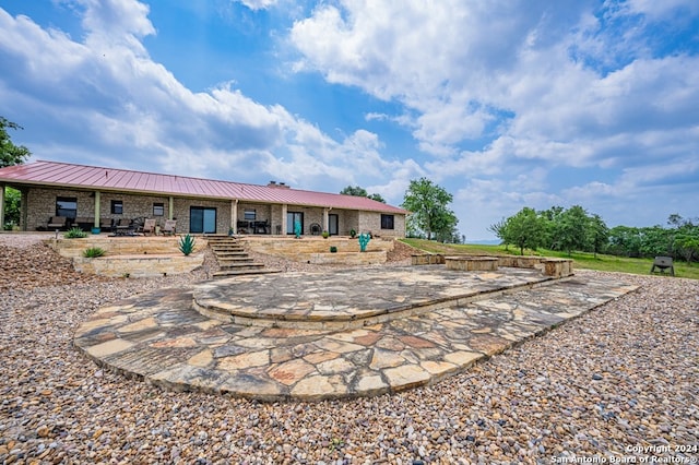 back of property with metal roof
