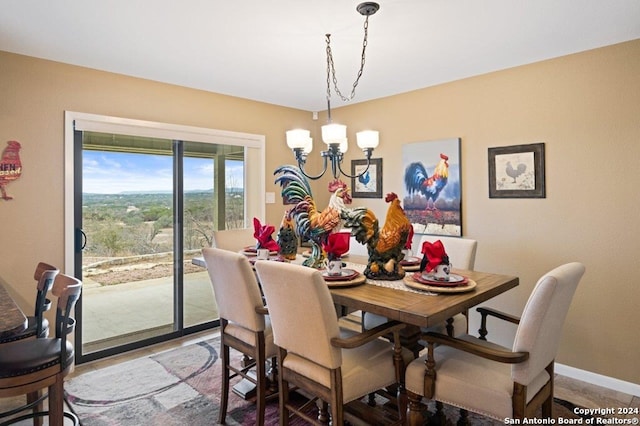 dining space with a notable chandelier