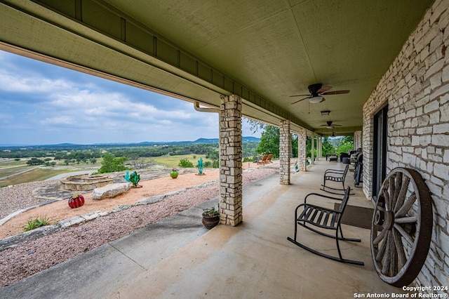 view of patio featuring ceiling fan