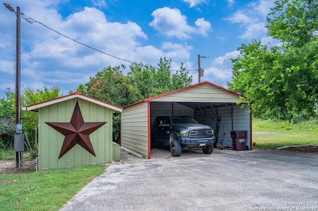 view of outbuilding featuring a carport