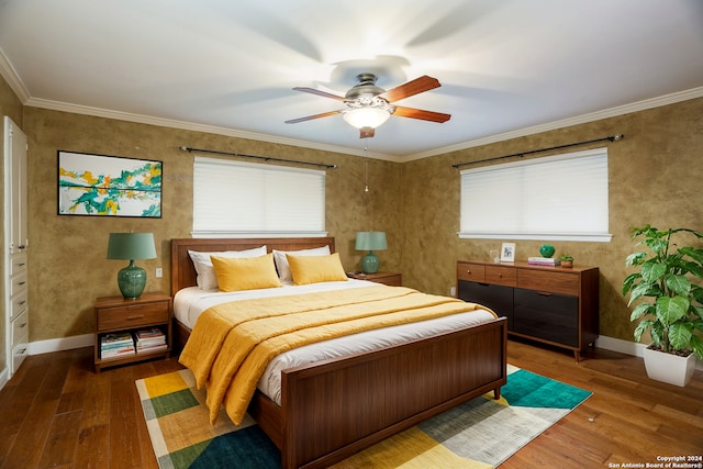 bedroom featuring ceiling fan, crown molding, and hardwood / wood-style flooring