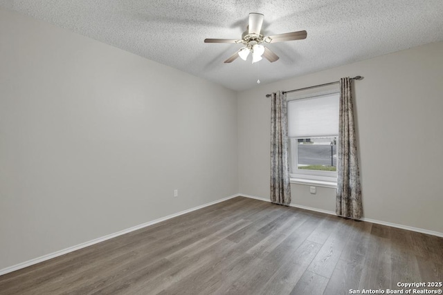 spare room featuring ceiling fan, a textured ceiling, and hardwood / wood-style flooring