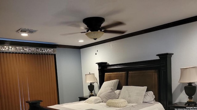 bedroom featuring ceiling fan and crown molding