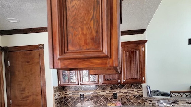 room details with a textured ceiling and tasteful backsplash