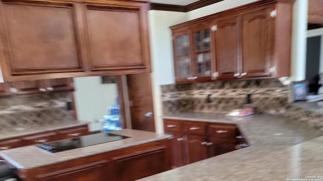 kitchen with tasteful backsplash and black electric cooktop