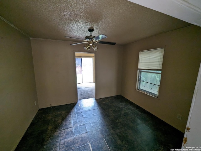 spare room with a textured ceiling