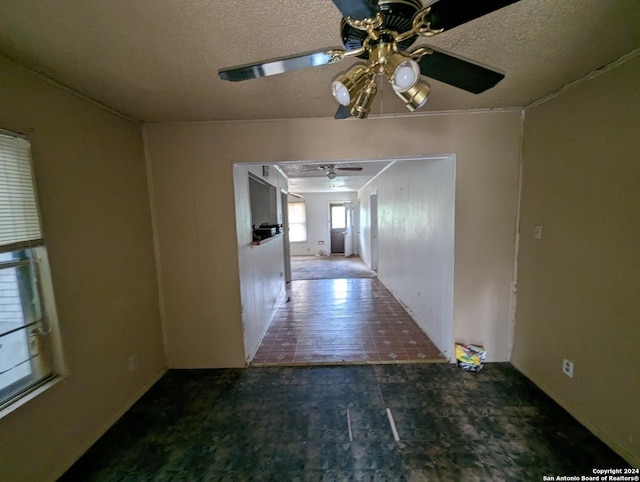 corridor with a textured ceiling