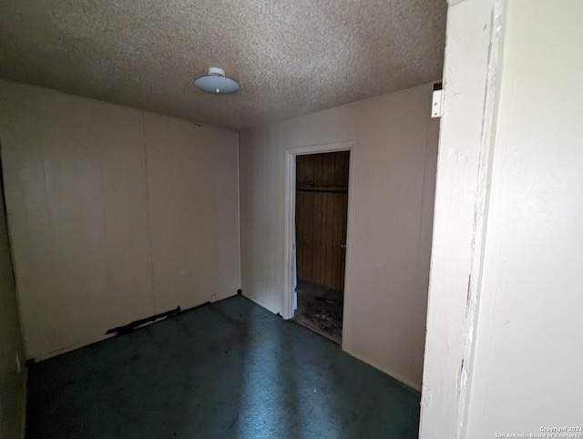 empty room with a textured ceiling