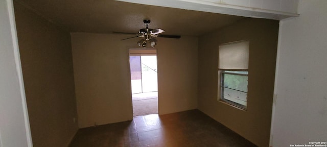 unfurnished room with ceiling fan