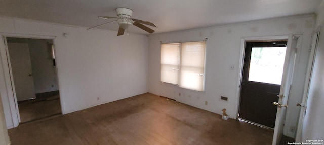 interior space with ceiling fan