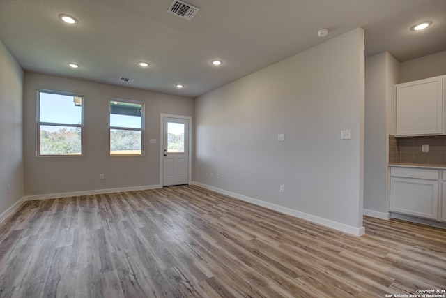 unfurnished room featuring light hardwood / wood-style flooring