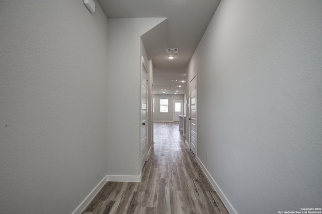 hallway featuring light hardwood / wood-style flooring