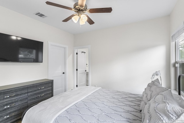 bedroom featuring connected bathroom and ceiling fan