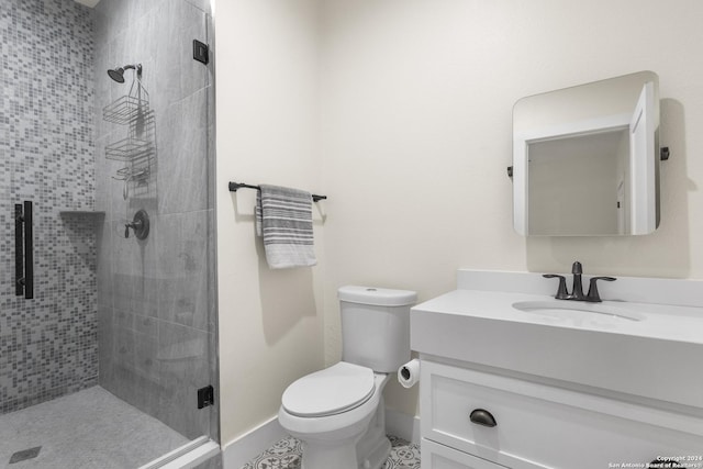 bathroom featuring vanity, toilet, and walk in shower