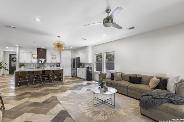 living room featuring ceiling fan