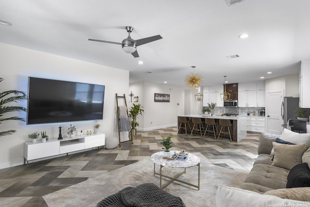 living room featuring ceiling fan