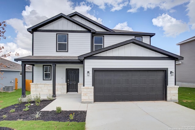 craftsman-style home featuring covered porch and central AC