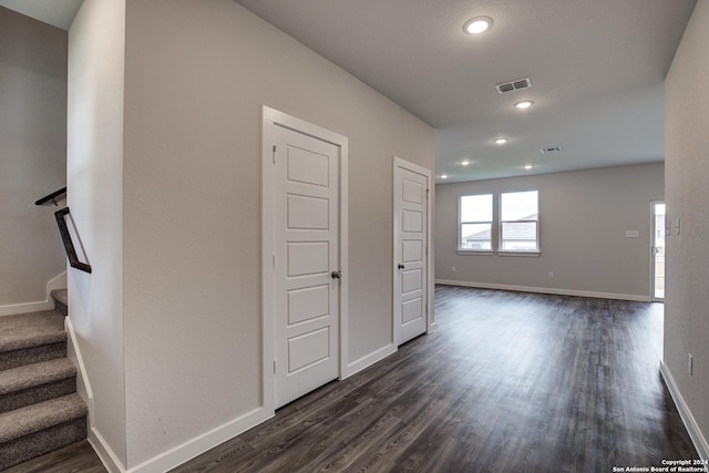 empty room featuring dark hardwood / wood-style flooring