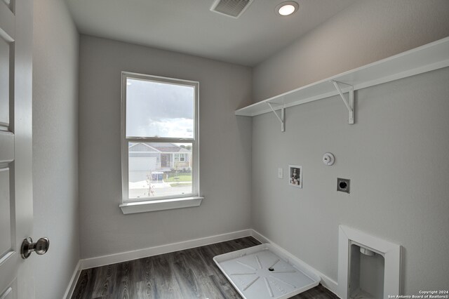 clothes washing area featuring hookup for an electric dryer, hookup for a washing machine, dark hardwood / wood-style floors, and hookup for a gas dryer