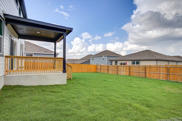 view of yard with a wooden deck