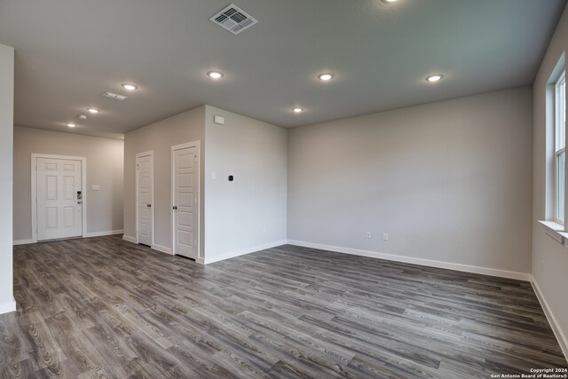 unfurnished room with dark hardwood / wood-style floors