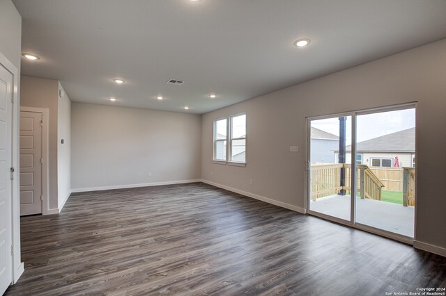 empty room with dark hardwood / wood-style floors