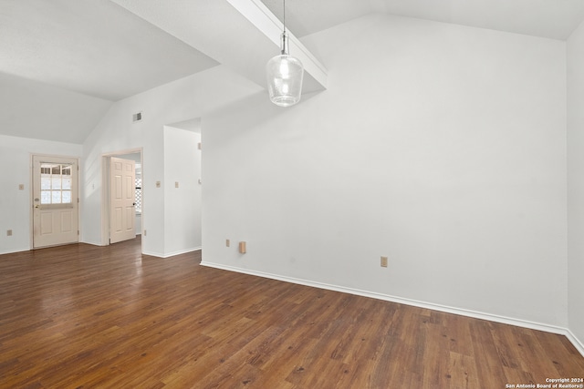 empty room featuring dark hardwood / wood-style flooring and lofted ceiling