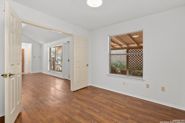 spare room with dark hardwood / wood-style flooring