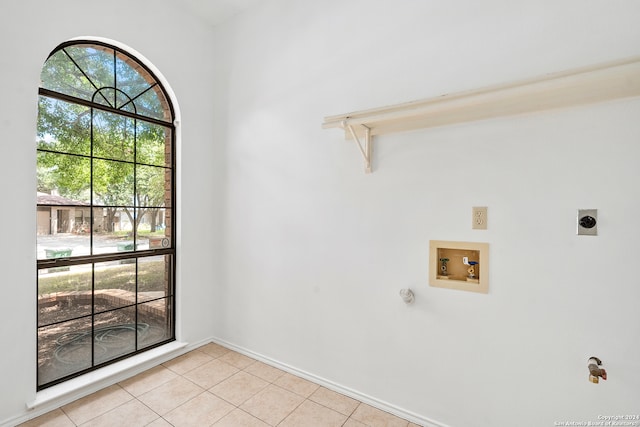 washroom with washer hookup, light tile floors, and hookup for an electric dryer