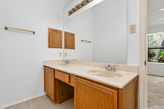 bathroom featuring tile flooring and double sink vanity