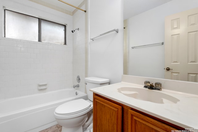 full bathroom featuring tile floors, tiled shower / bath, toilet, and vanity