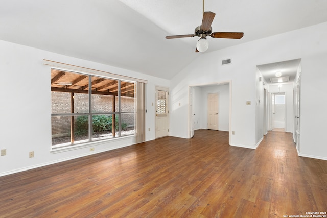 empty room with ceiling fan, dark hardwood / wood-style flooring, and lofted ceiling