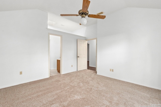 spare room with carpet flooring, ceiling fan, and vaulted ceiling