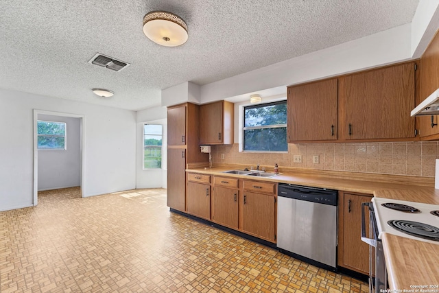 kitchen featuring dishwasher, sink, decorative backsplash, white electric range oven, and a textured ceiling