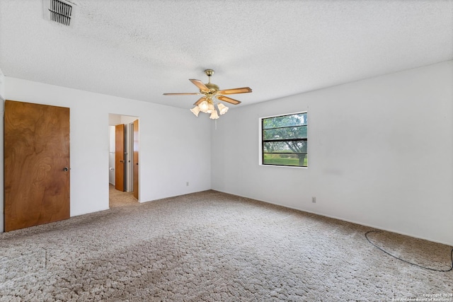 carpeted empty room with a textured ceiling and ceiling fan