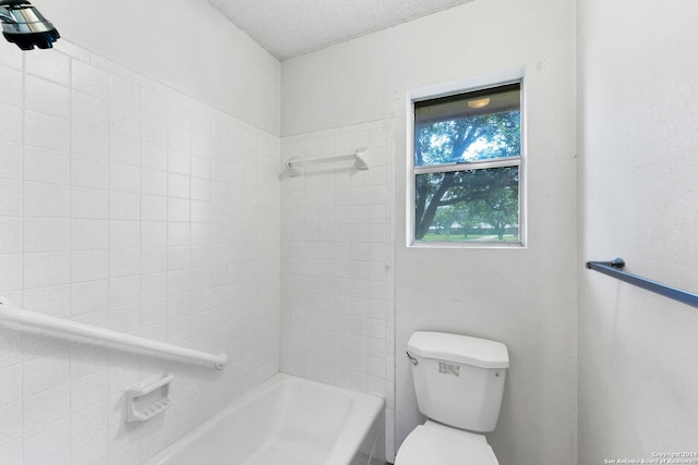 bathroom featuring toilet and a textured ceiling