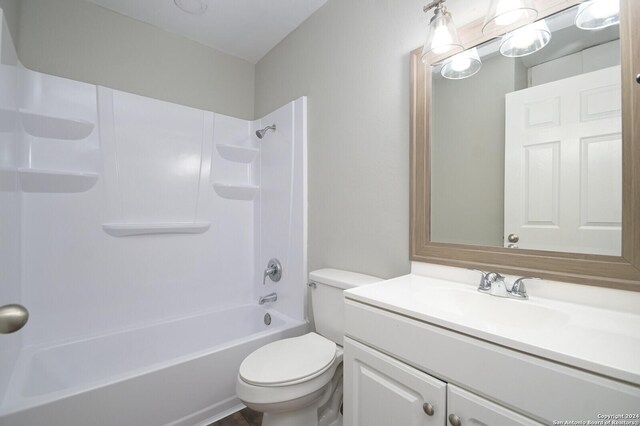 full bathroom with shower / bathing tub combination, vanity, and toilet