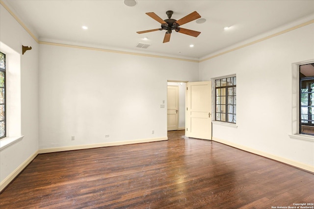 unfurnished room with crown molding, dark hardwood / wood-style floors, and ceiling fan