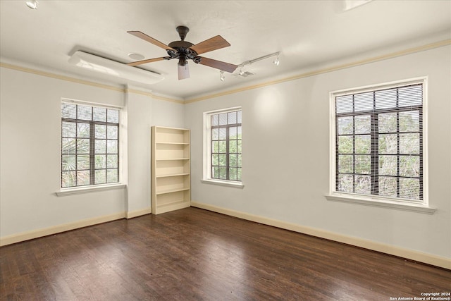 spare room featuring ceiling fan, ornamental molding, dark hardwood / wood-style floors, and track lighting