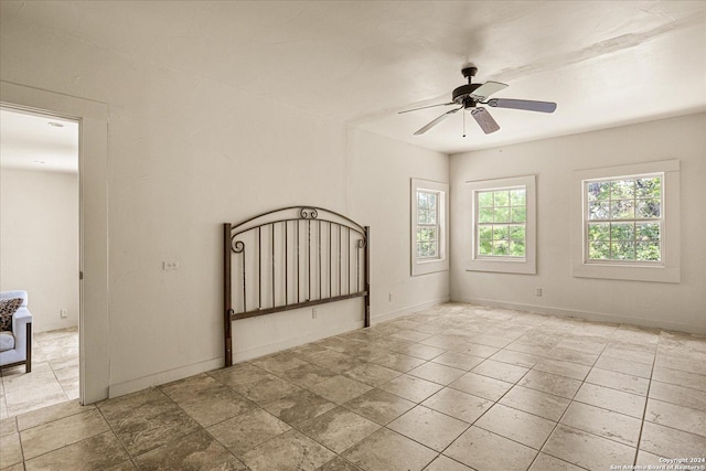 unfurnished bedroom featuring ceiling fan