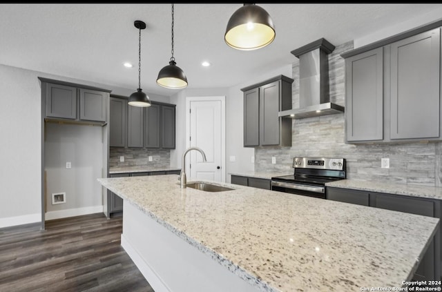 kitchen with gray cabinetry, sink, wall chimney exhaust hood, hanging light fixtures, and stainless steel range with electric stovetop