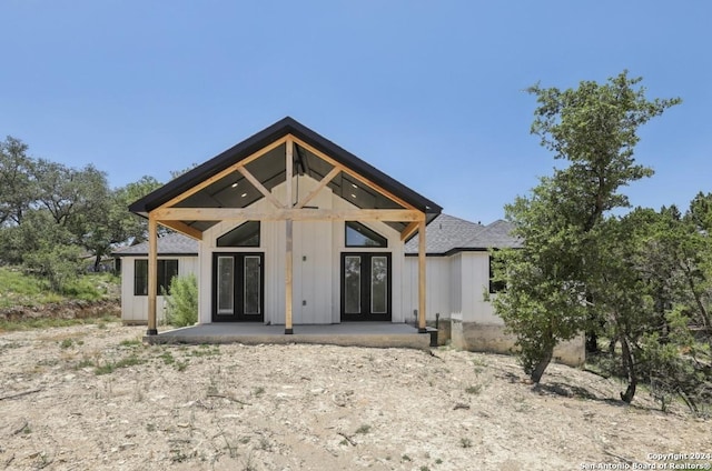 back of property with french doors and a patio